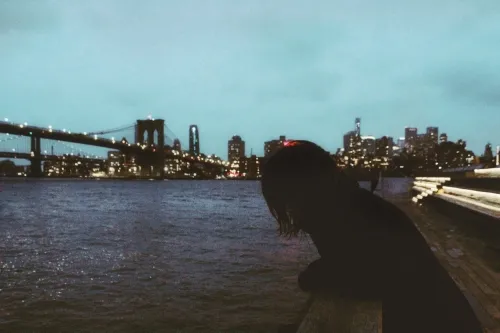 A person leaning against the rail.