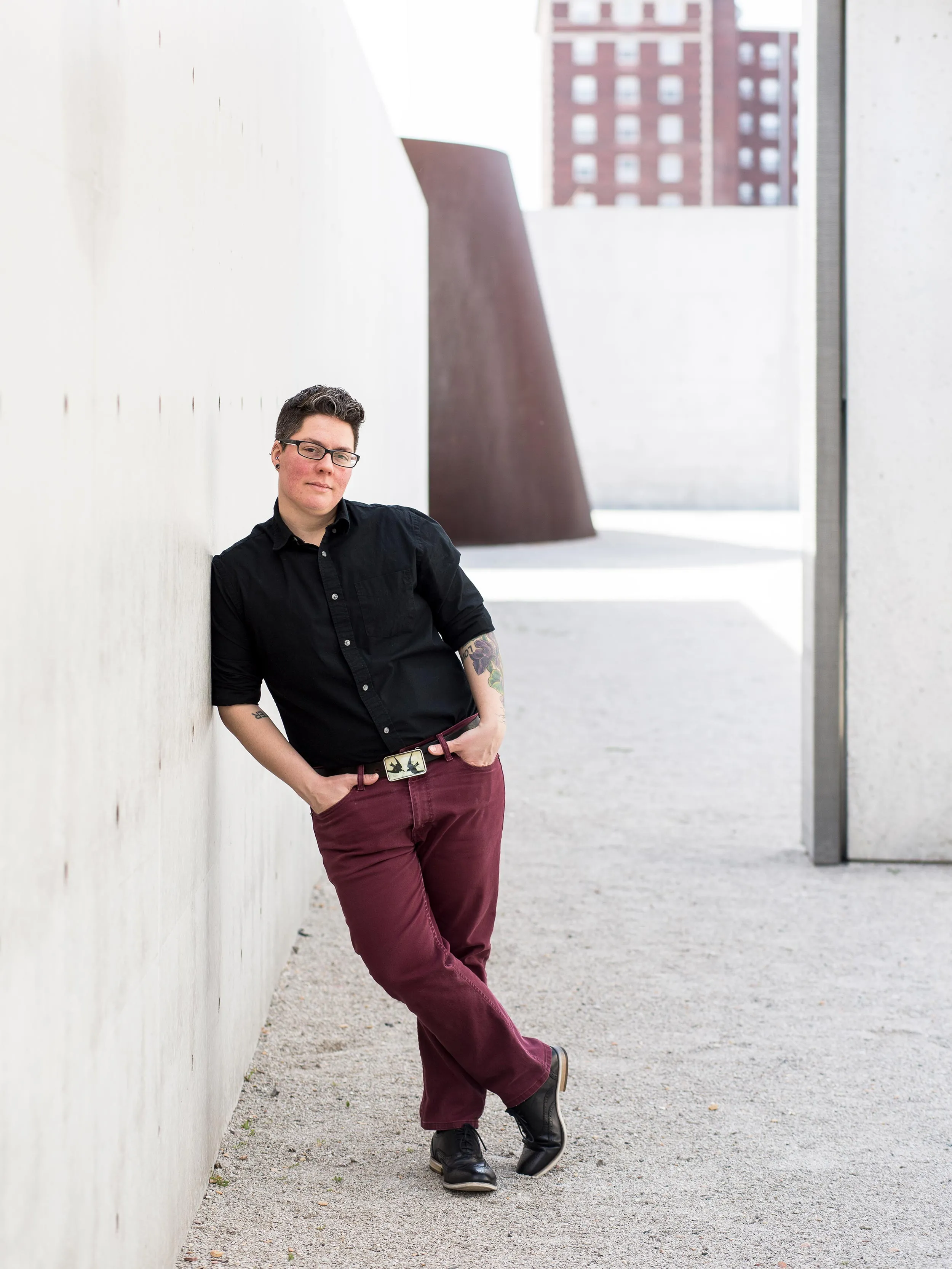 A person leaning on the wall.