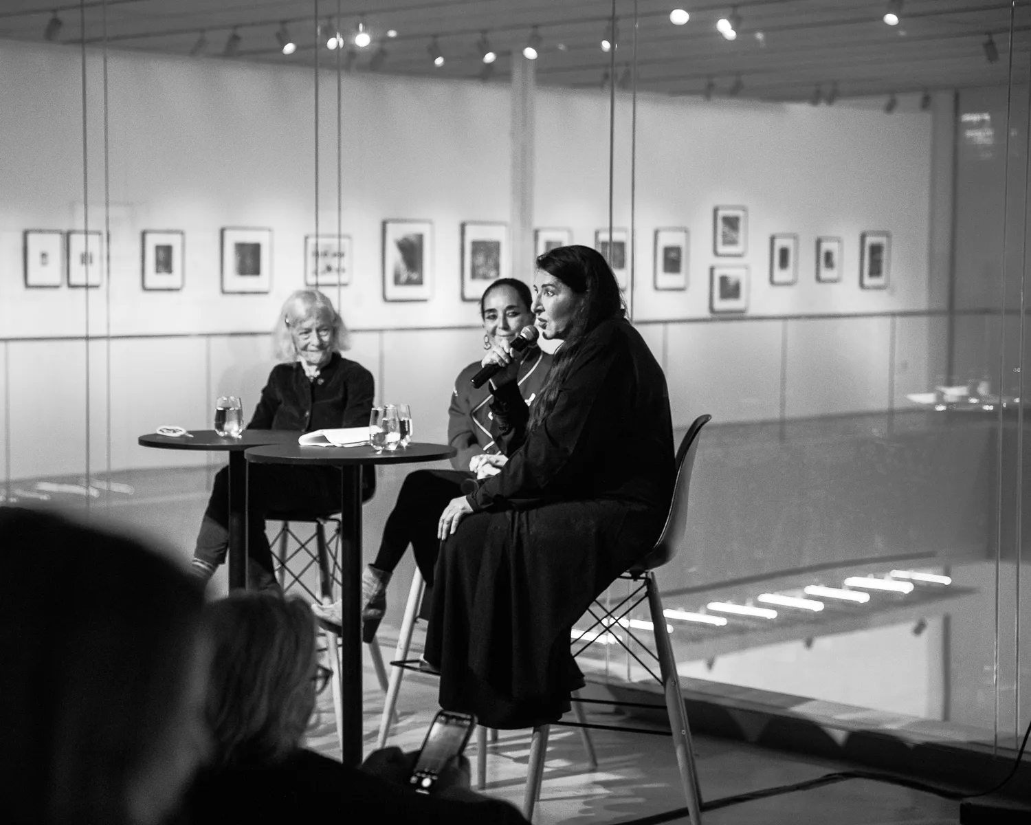 Three women giving a talk