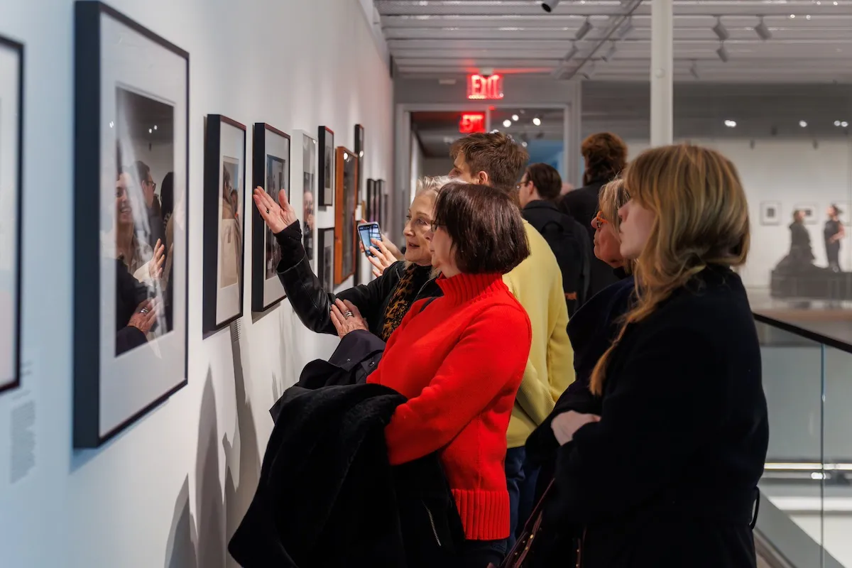 Group of people engaging with an exhibition