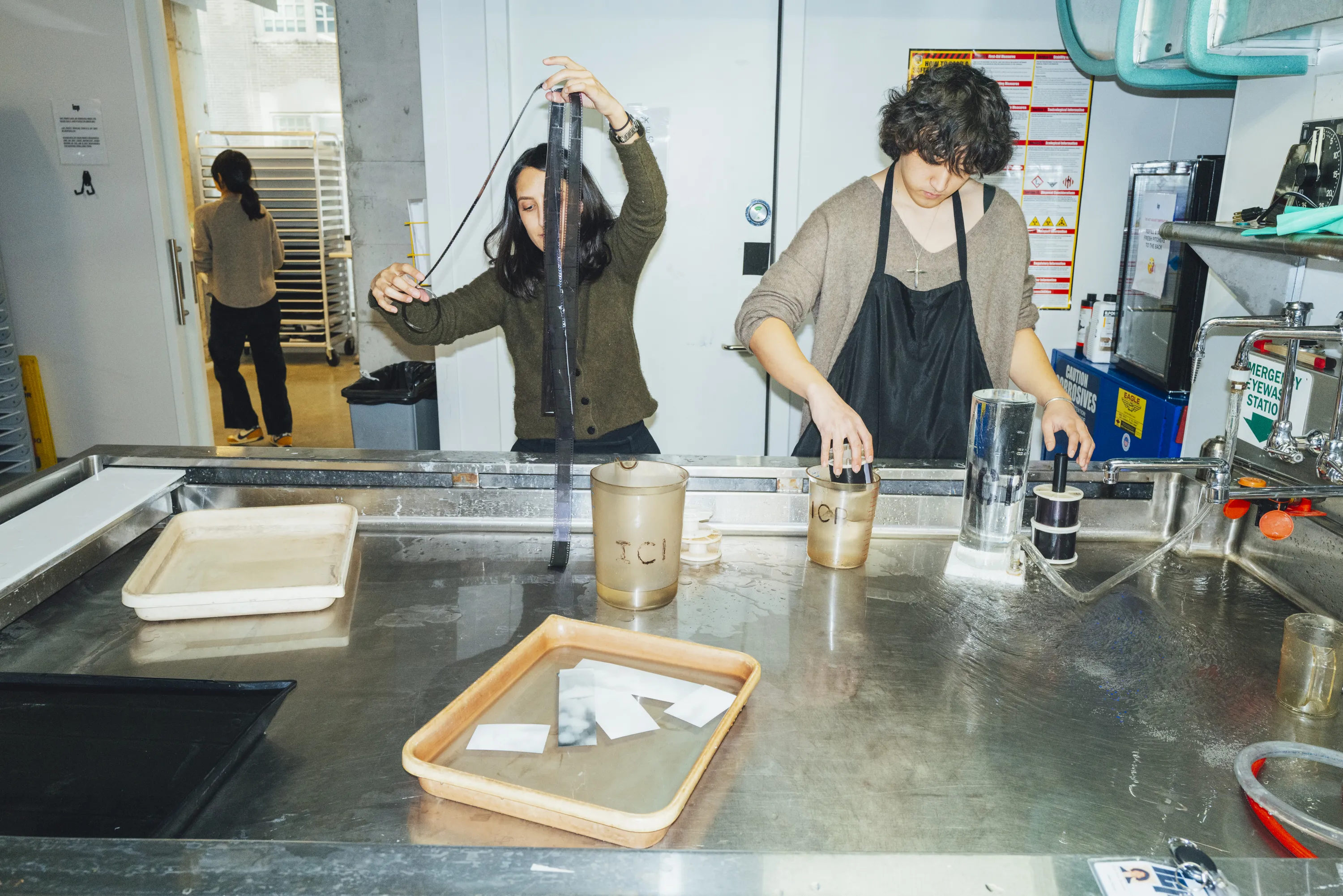 Students processing film in ICP darkroom