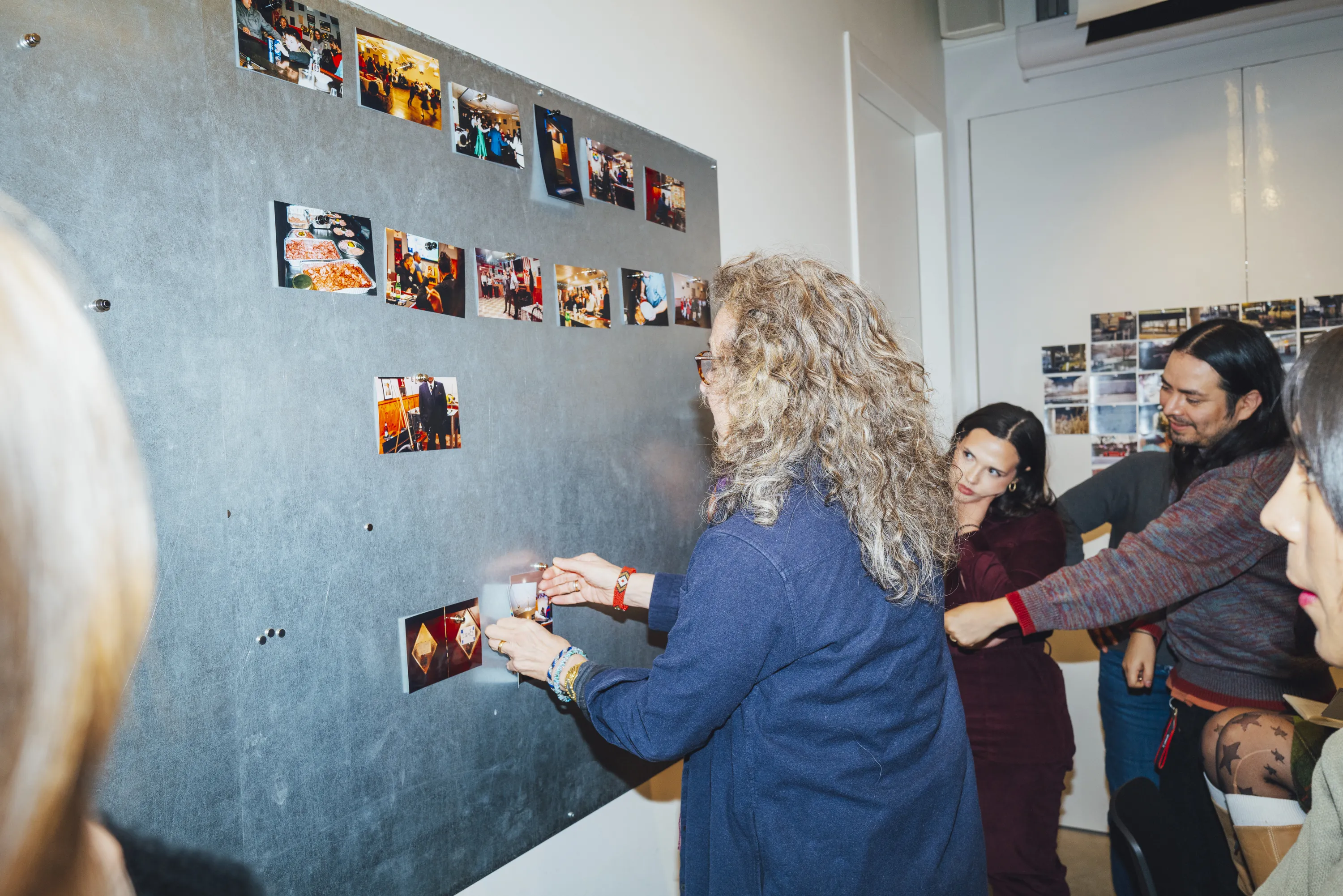 Students and program chair evaluating images